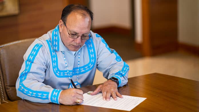 Chief Gary Batton signs the Voter Registration and Voter Education Week Proclamation