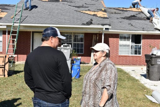 Chief Batton visits with those that received tornado damage