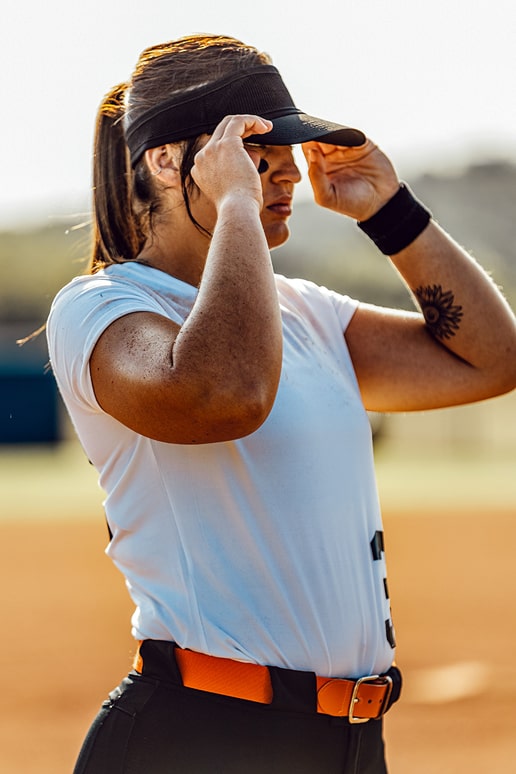 Michaela Richbourg adjusting hat at base