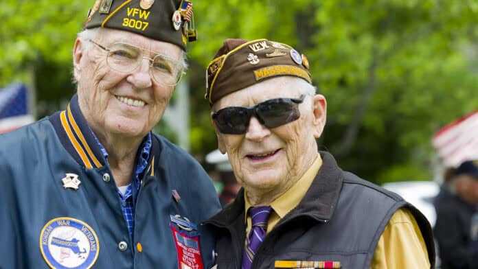 Two veterans standing together